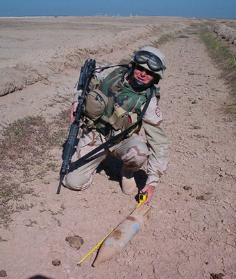 Army veteran Andrew Myatt clears an unexploded ordnance (UXO) device while serving in Iraq in 2004.